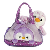 Purple PomPom Penguin plush from Fancy Pals by Aurora, nestled in a shimmering lavender carrier with polka dots