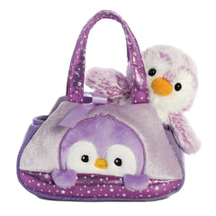 Purple PomPom Penguin plush from Fancy Pals by Aurora, nestled in a shimmering lavender carrier with polka dots