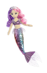 A multicolored mermaid plush toy from Sea Sparkles by Aurora with pink and purple hair and a silver crown.
