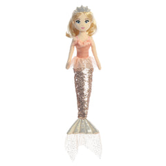 A mermaid plush toy with a peach tutu from Sea Sparkles by Aurora with a sparkling tail and blonde hair.