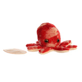 A red octopus plush toy from Shoulderkins by Aurora with big eyes and floppy tentacles.