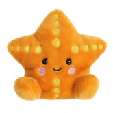 Starfish plush from Palm Pals gleaming in a golden hue with vibrant yellow details, and fits in the palm of your hand.