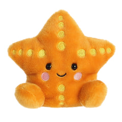 Starfish plush from Palm Pals gleaming in a golden hue with vibrant yellow details, and fits in the palm of your hand.