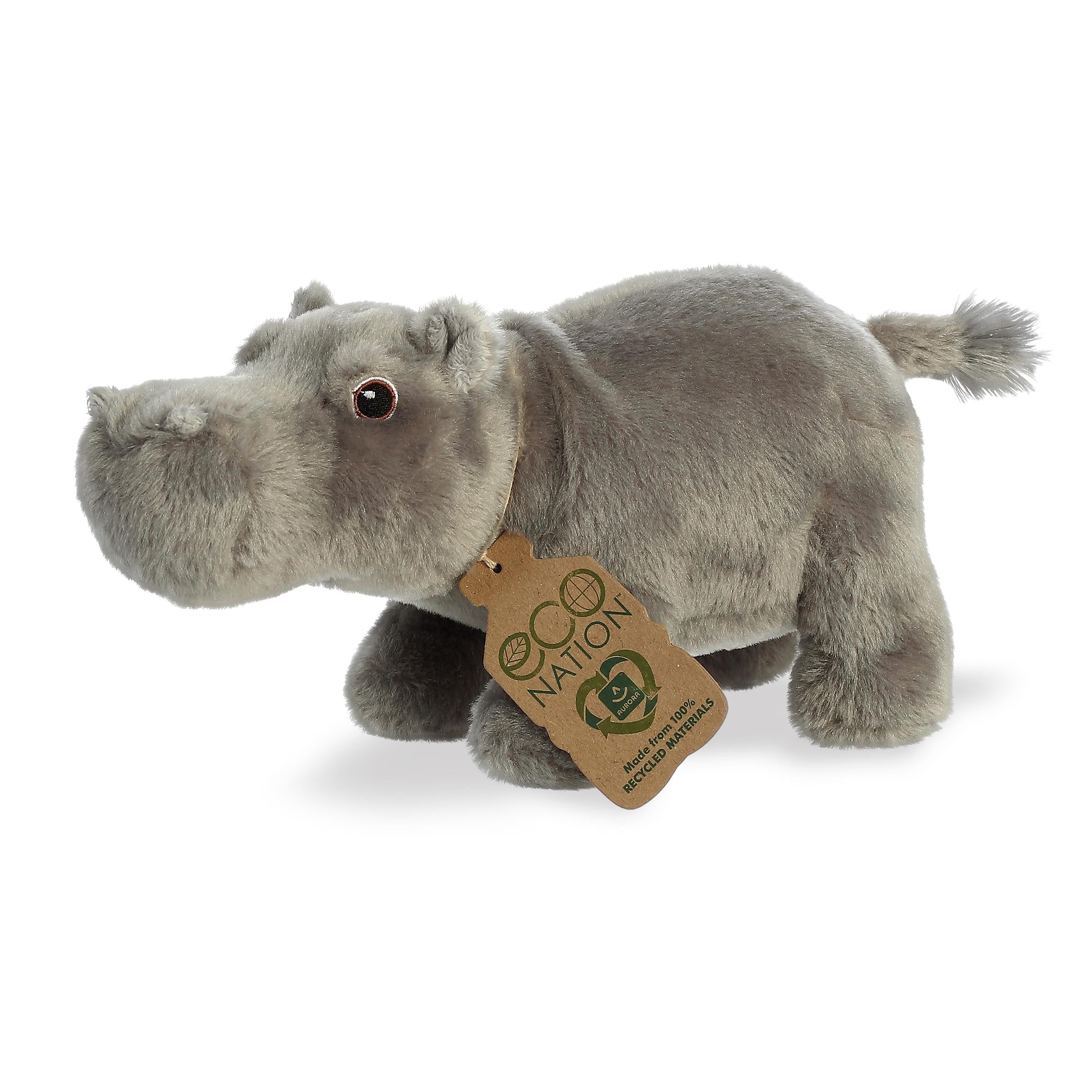 A captivating hippo plush with an all-grey coat, beautiful embroidered eyes, and an eco-nation tag around its neck