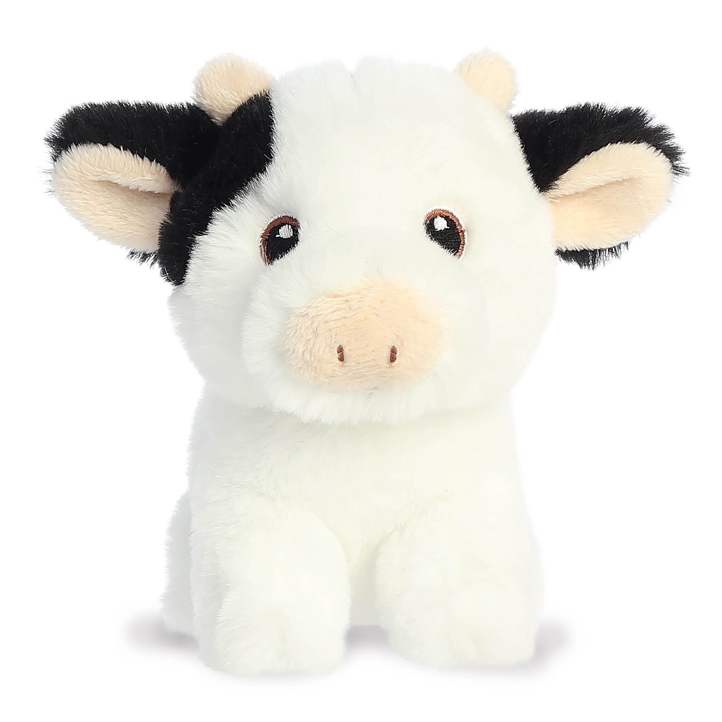 Lovable mini cow plush with the classic white and black cow pattern, embroidered eyes, and an eco-nation tag