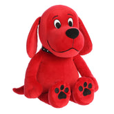 Clifford big red dog plush by Aurora, sporting his iconic red hue and black studded collar, in a patient seated position.