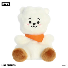 Cute mini BT21 plush toy with a fluffy white body, orange toes, wearing an orange scarf, and black accents on a smiling face