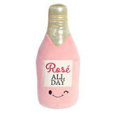 Aurora Plush Rosé bottle in a soft pink hue with 'Rosé All Day' embroidery and a playful winking expression