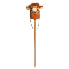 A Highland cow plush stick toy with a soft cow head and wooden stick from Aurora’s Giddy-Up Friends collection.
