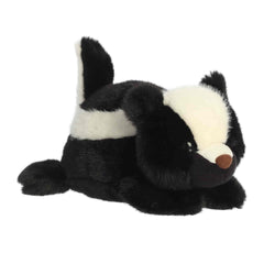 A soft black-and-white plush skunk with a relaxed expression from Rumplers by Aurora plush.