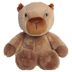 A capybara plush toy from Aurora with oversized stitched paws, neutral fur, and a softly weighted body.