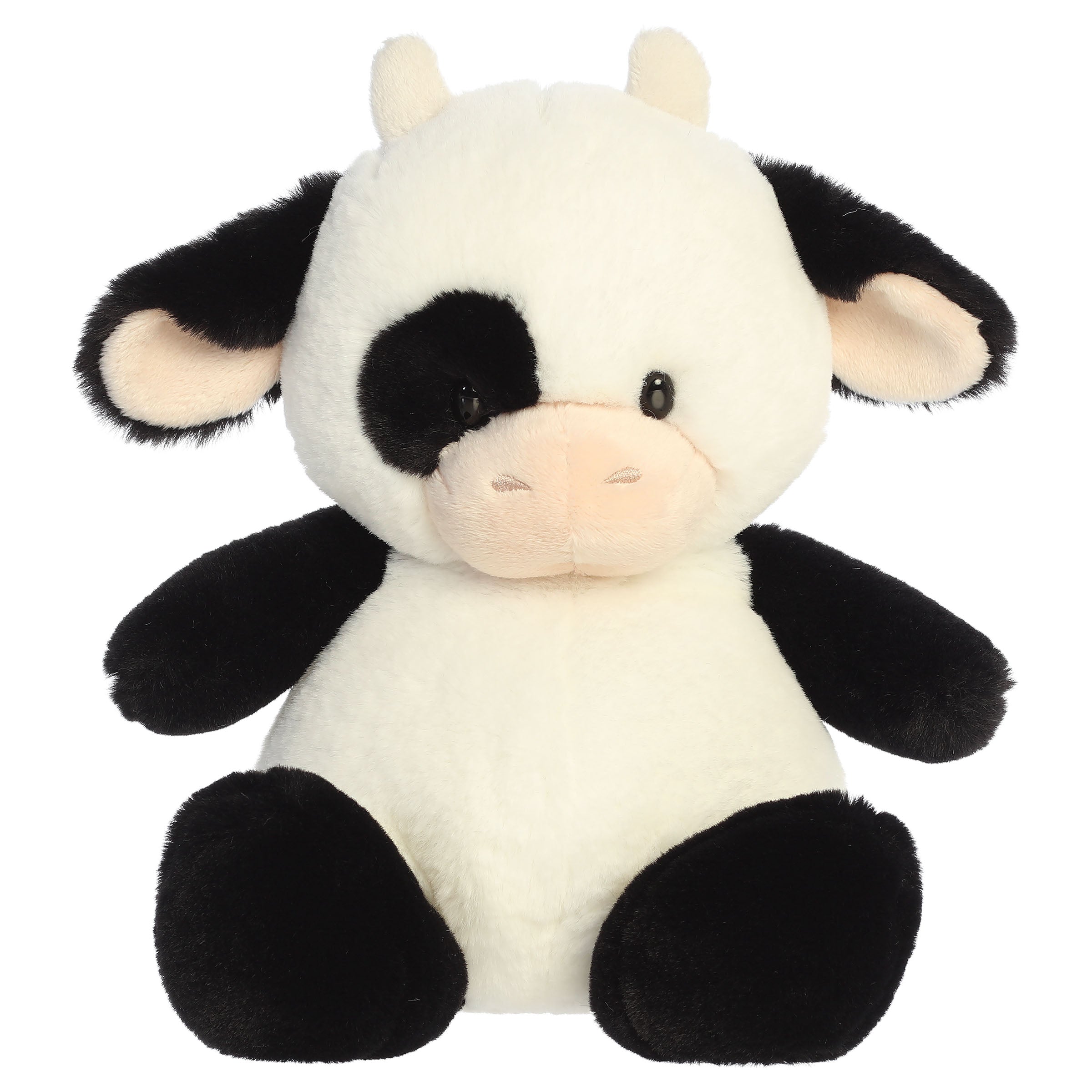 A cow plush toy from Aurora with tiny limbs, a black-and-white pattern, and a plump bean-weighted body.