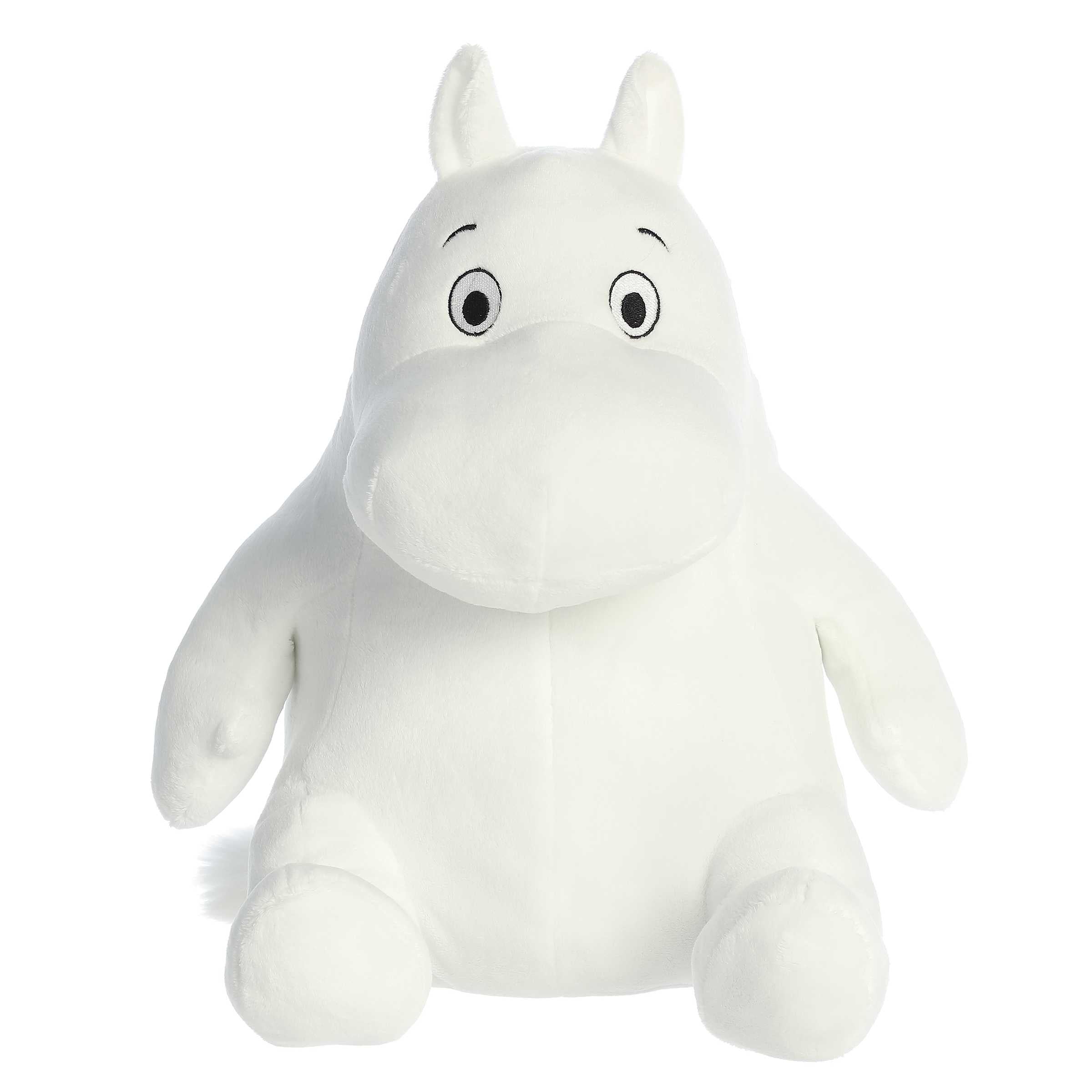 A Soft white Moomin plush in a seated position, with the iconic plump body and expressive eyes, ready for cozy snuggles