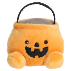 Orange pumpkin candy bucket plush with a smiling jack-o'-lantern face