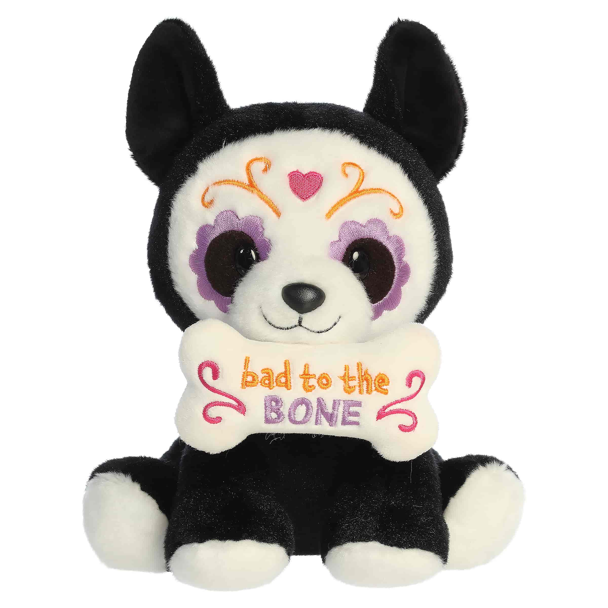 Black and white Xolo dog plush with sugar skull details and a themed sign