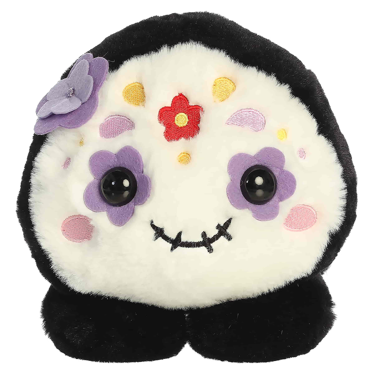 Black and white sugar skull plush with colorful festive details