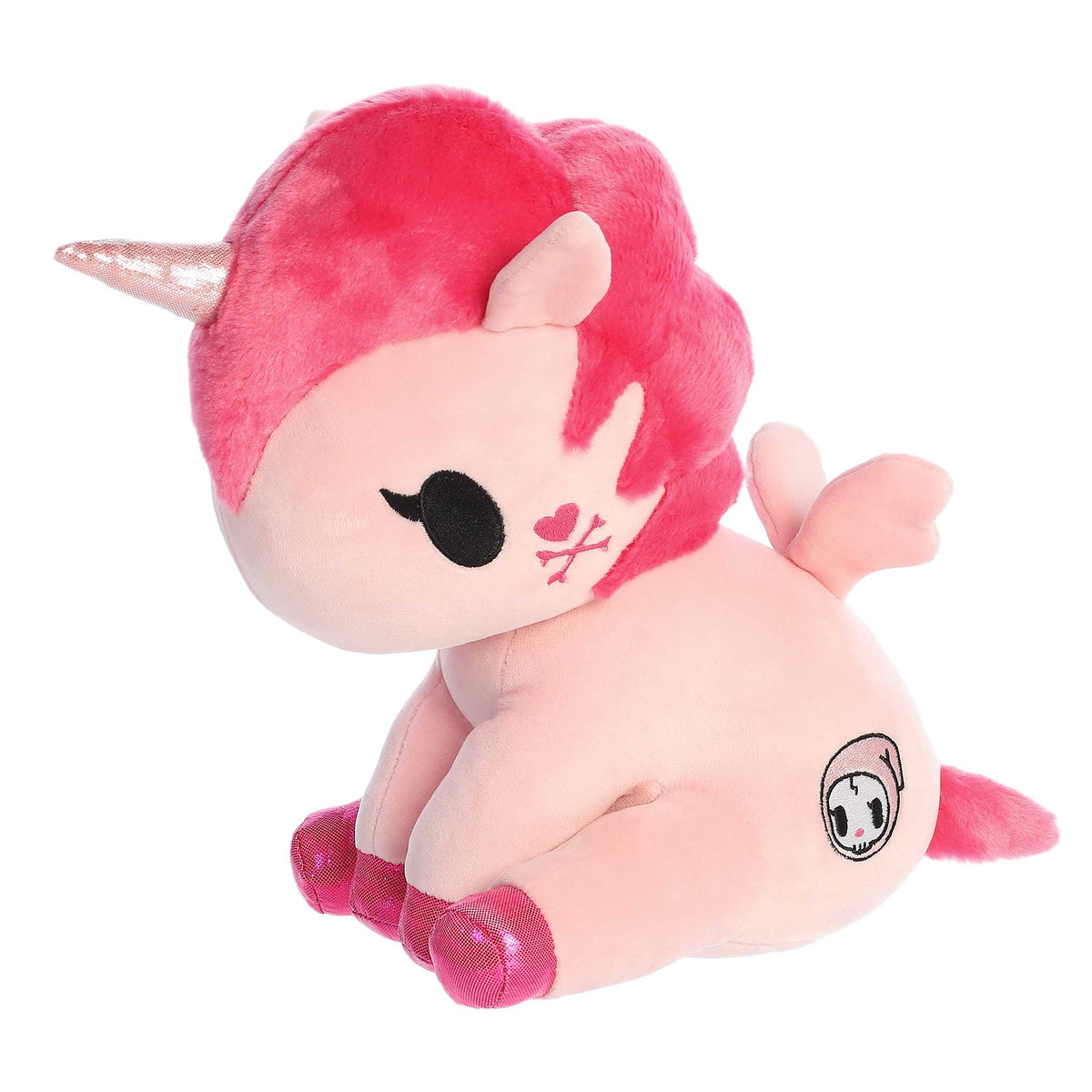 Cute colorful unicorn plush in a sitting position with pink body and bright pink fur, sparkly hooves and detailed embroidery.