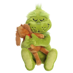 Grinch plush hugging Max in a sweet holiday pose