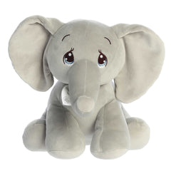 A seated squishy elephant plush with big teardrop-shaped eyes, flappy ears, and an inspirational tag.