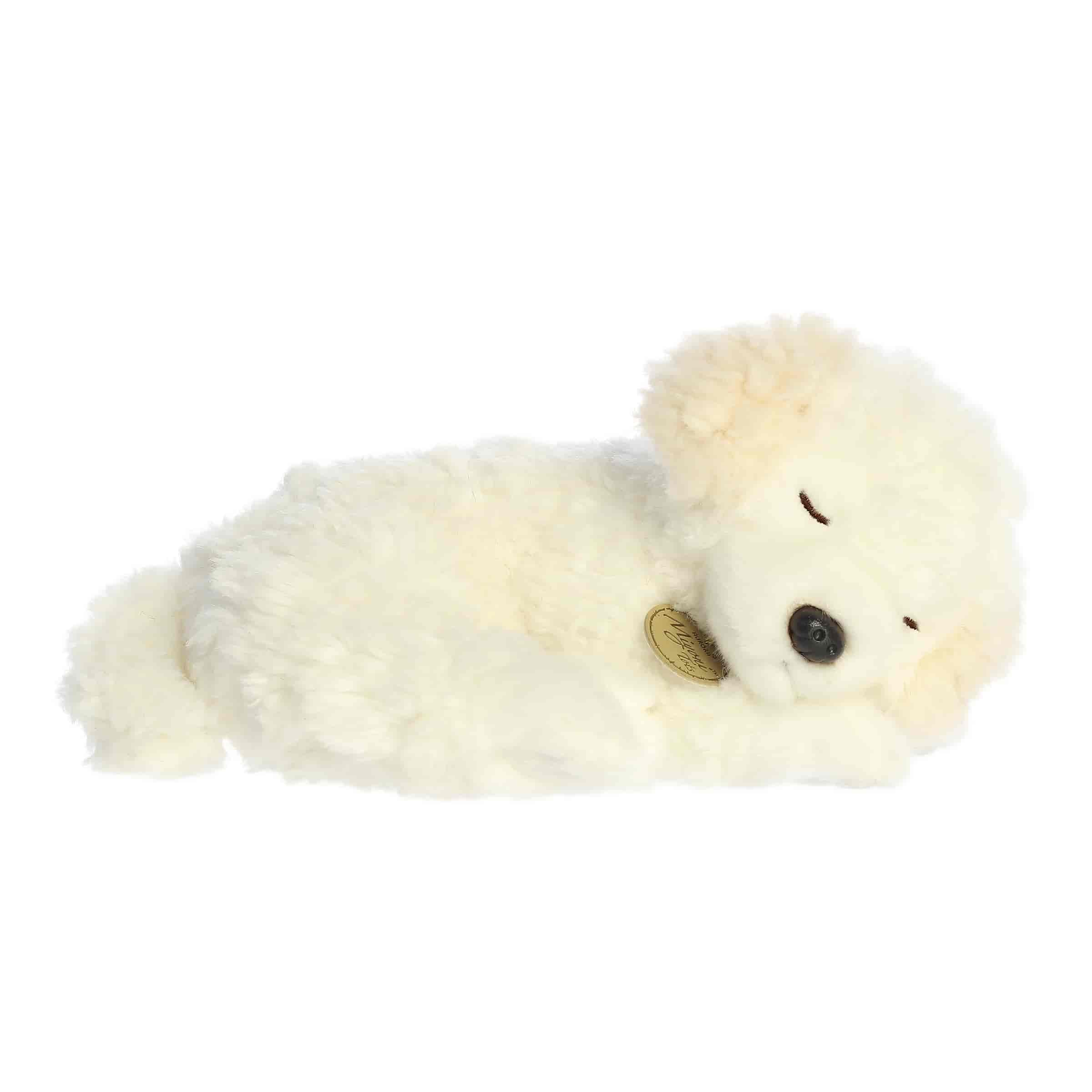 A soft cream plush poodle puppy in a relaxed sleeping pose from Miyoni Tots by Aurora.
