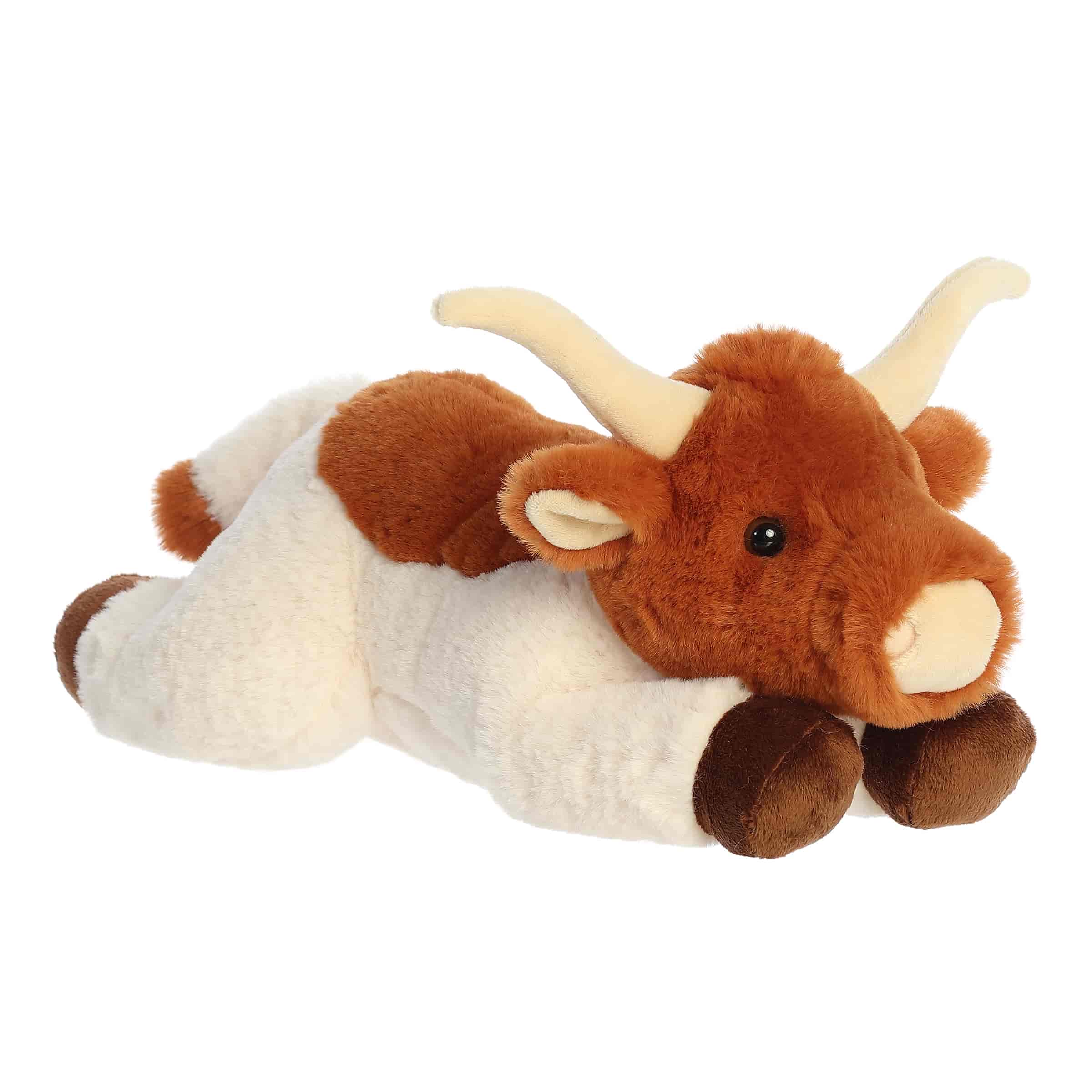 A soft rust-colored plush longhorn cow with curved horns in a flopped pose from Flopsie by Aurora.