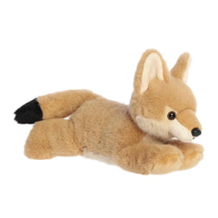 A soft tan plush coyote with pointed ears and a floppy body from Flopsie by Aurora.