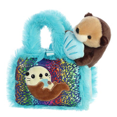 Zoo Collection Sea Otter plush from Fancy Pals, nestled in a blue plush carrier with sea patterns