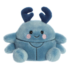 Plush toy of a blue beetle in the Palm Pals collection with pink cheeks and friendly eyes.