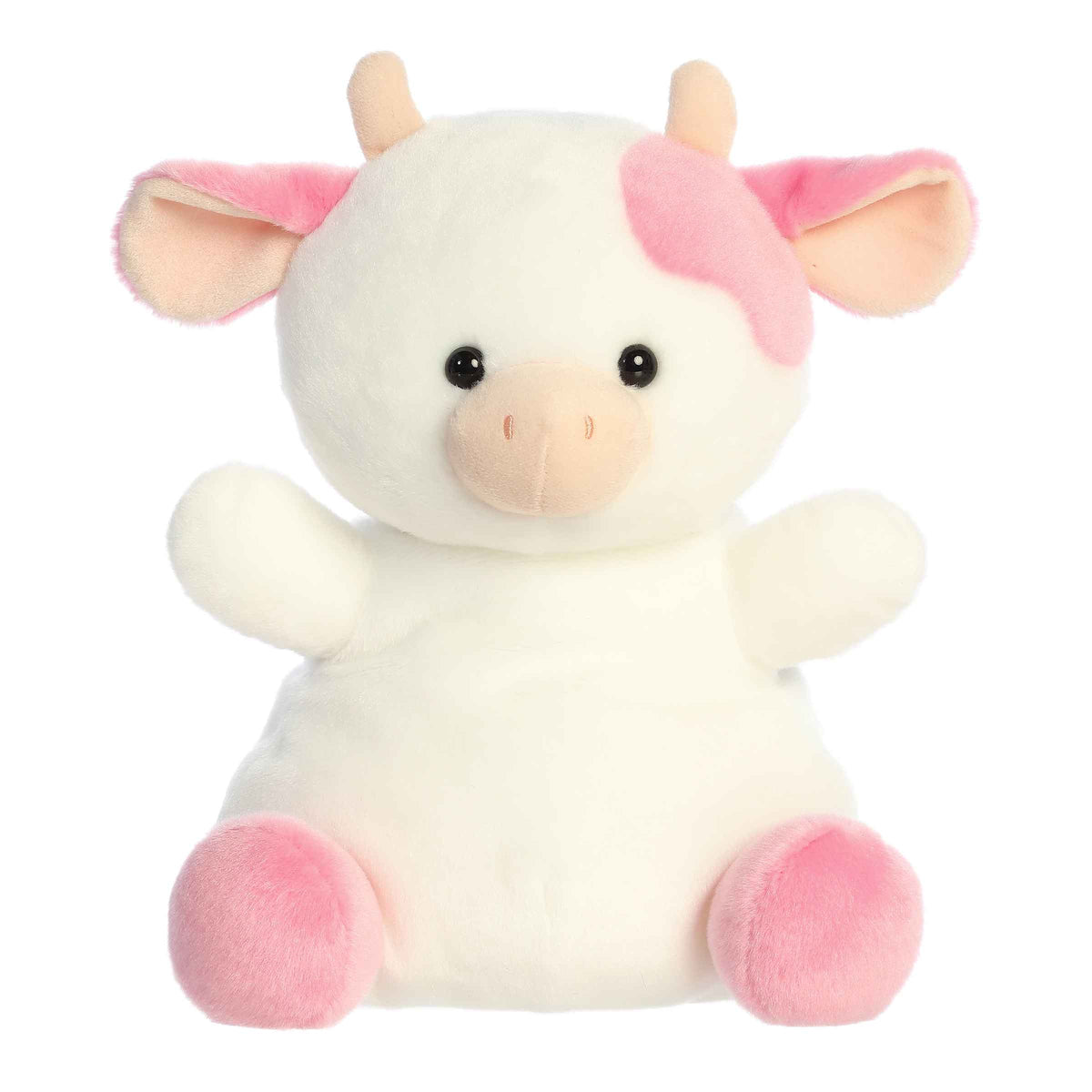 Larger plush toy of a white cow plush decorated with pink strawberry patches.