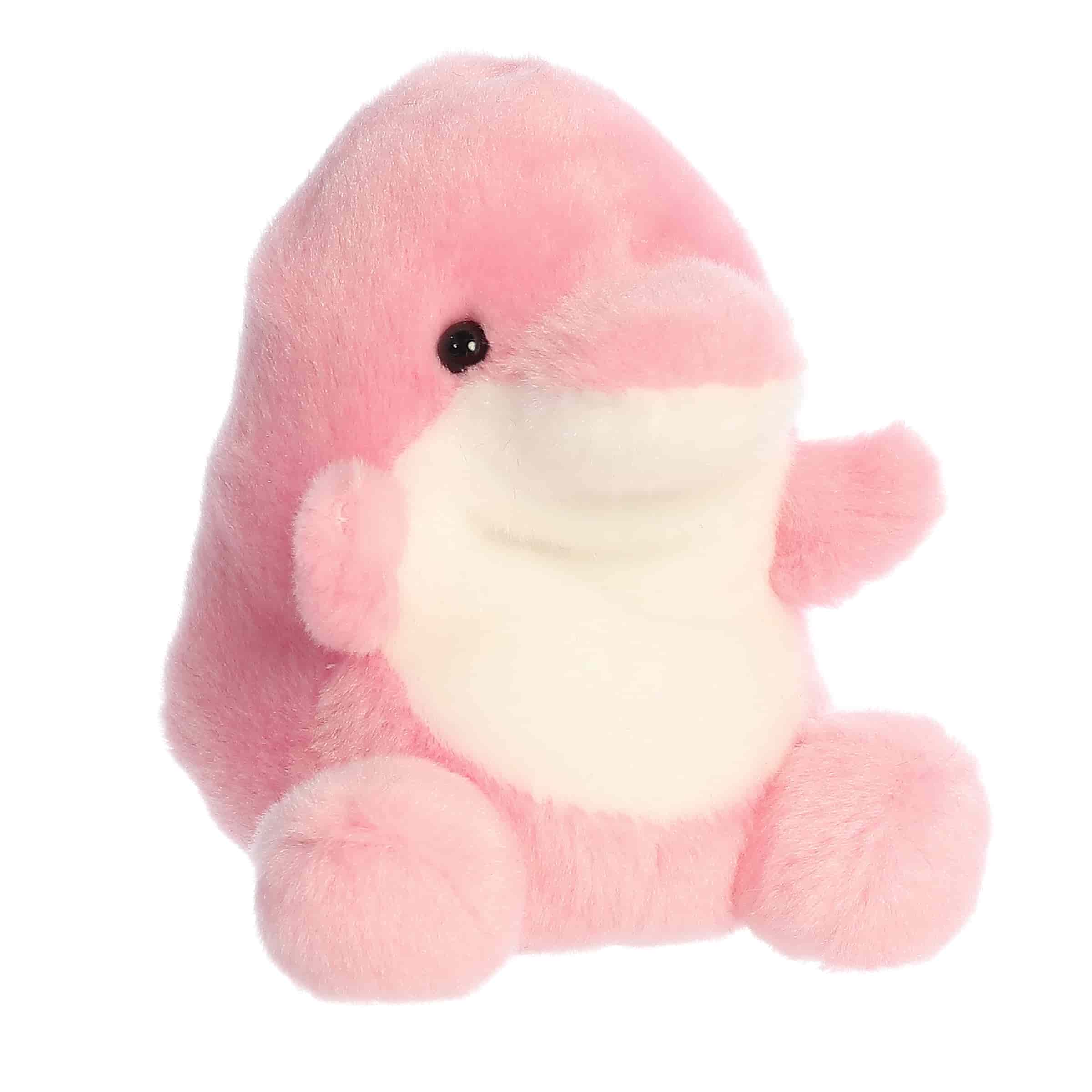 Plush toy of a pink dolphin by Palm Pals with a round white belly, flippers, and a sweet smiling face.