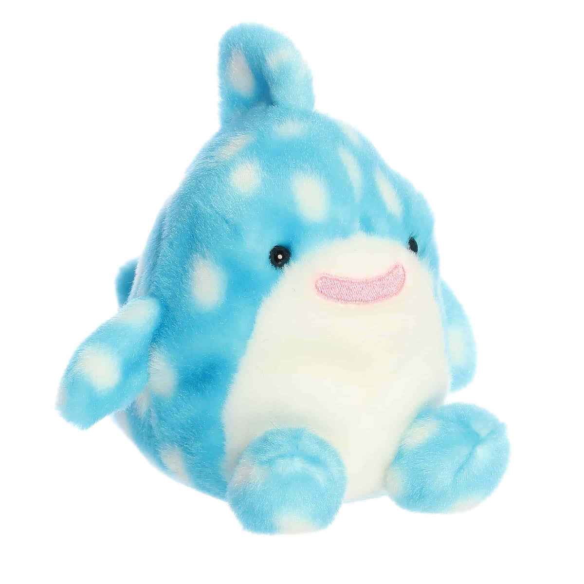 Plush toy of a blue whale shark by Palm Pals with white polka dots, curved fin, and a cheerful stitched smile.