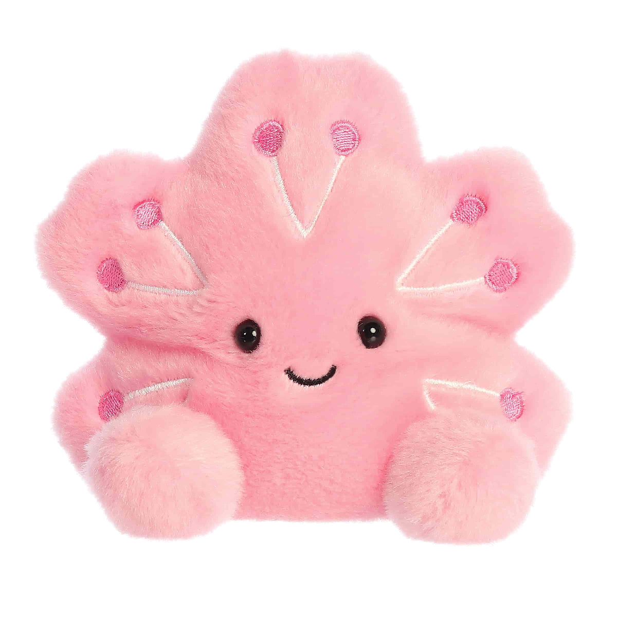 Plush toy of a pink cherry blossom by Palm Pals with purple dots, petal arms, and a gentle smiling face.