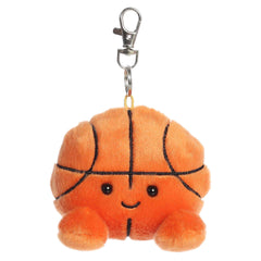 Plush keychain of an orange basketball by Palm Pals with black lines, stitched arms, and a game-day grin.