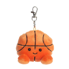 Plush keychain of an orange basketball by Palm Pals with black lines, stitched arms, and a game-day grin.