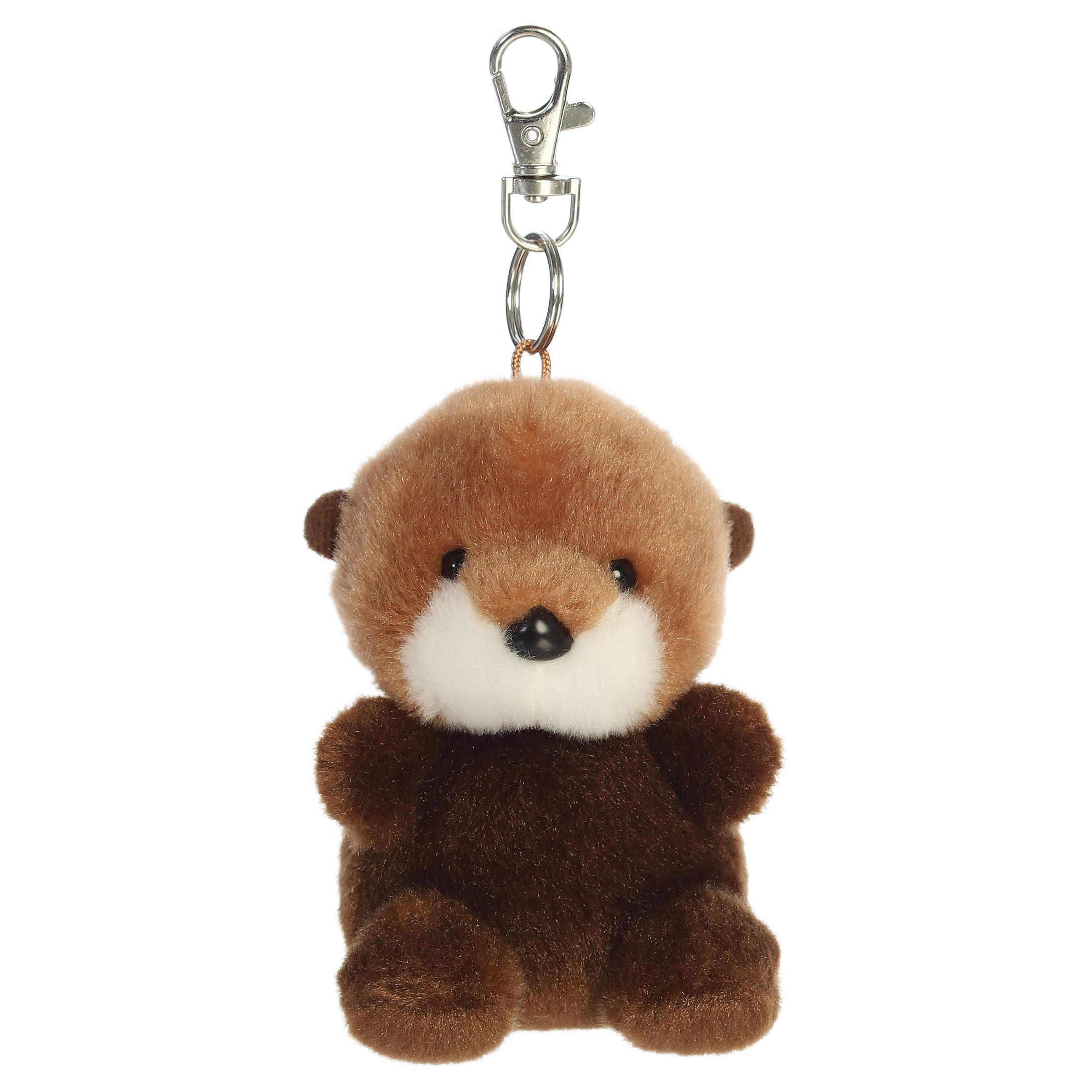 A sea otter plush clip-on from Aurora with brown fur, a white face and tummy, and tiny paws.