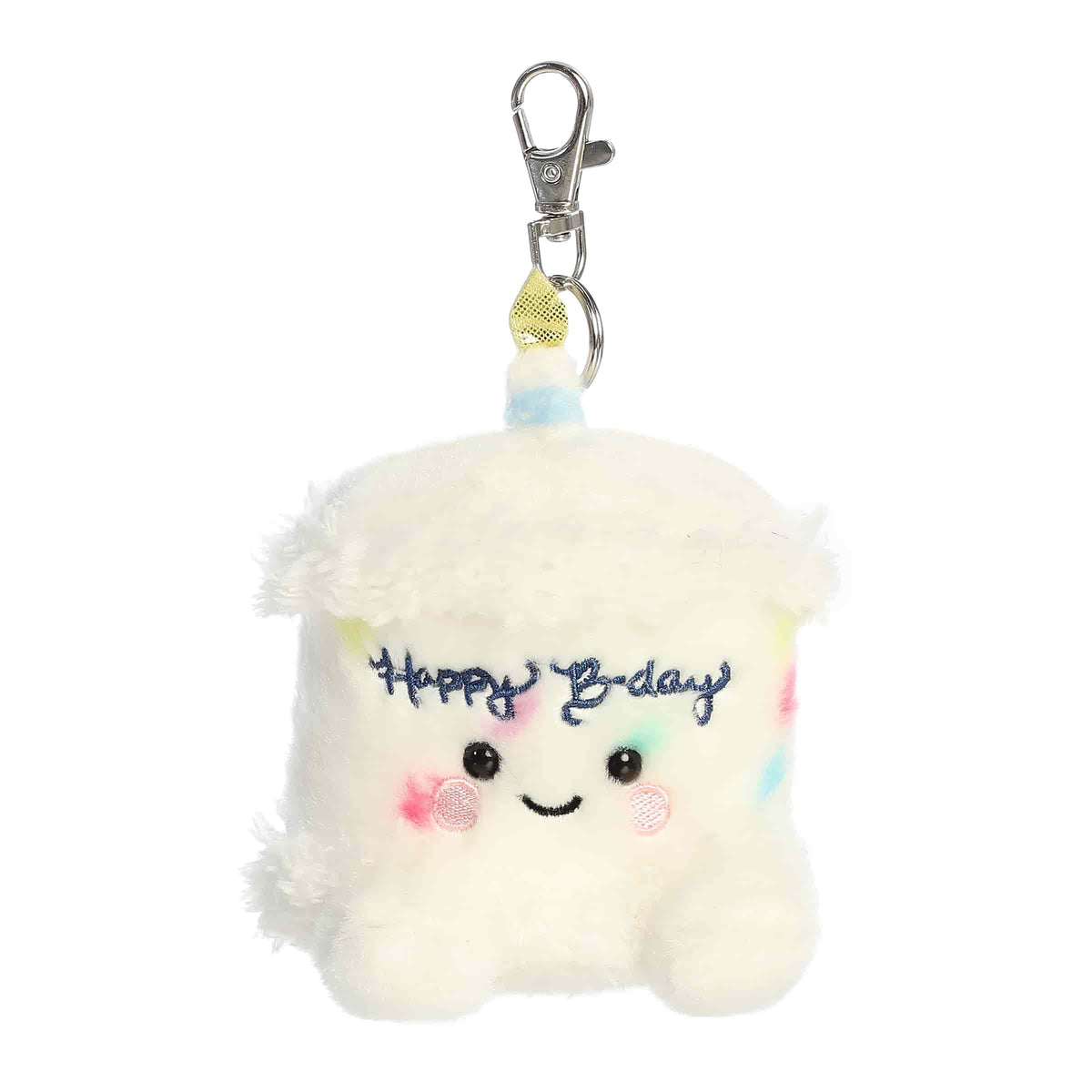 Plush keychain of a white birthday cake slice by Palm Pals with sprinkles, a blue candle, and rosy cheeks.