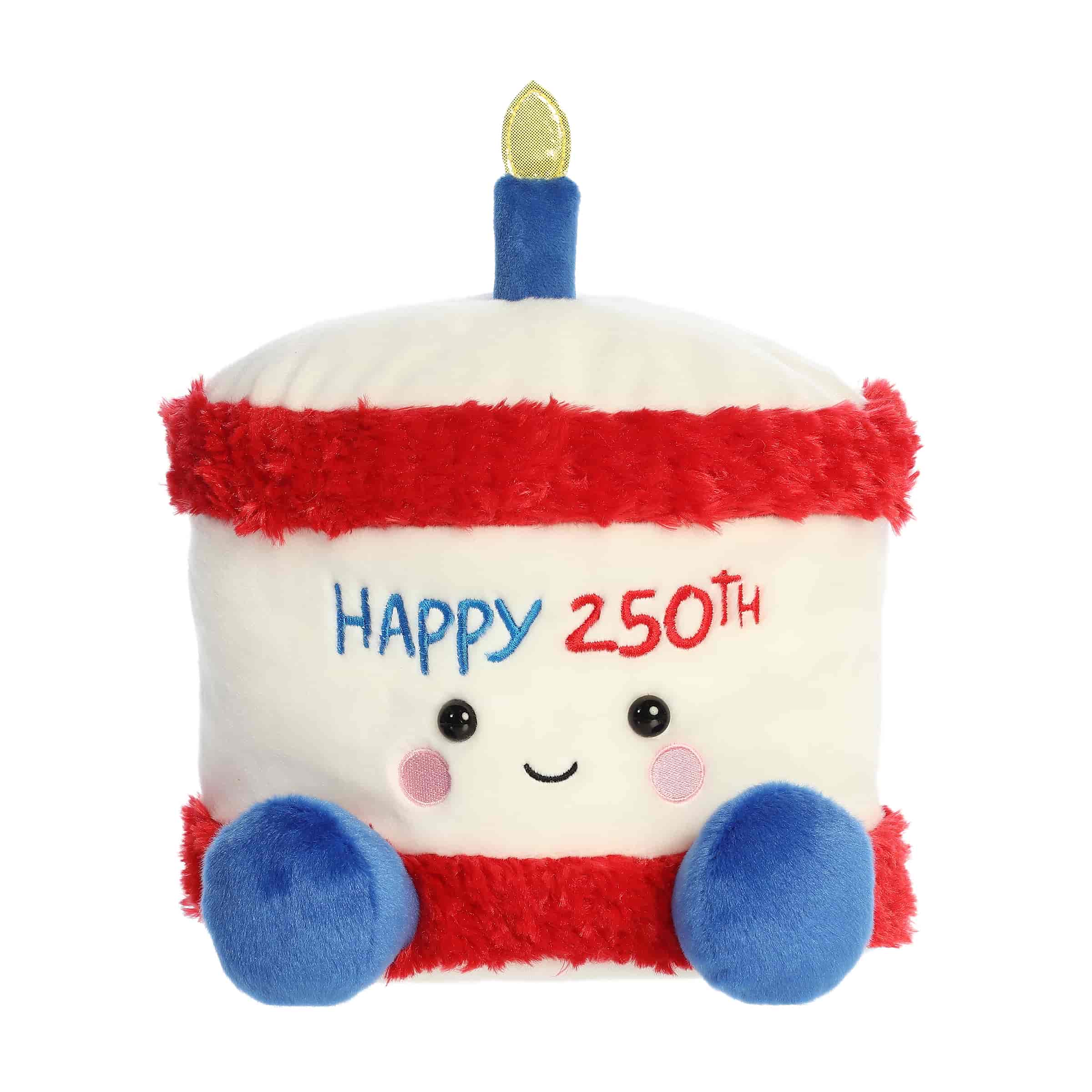 A large red, white, and blue cake plush with “Happy 250th” embroidery and a gold candle from Party-Sized Palm Pals
