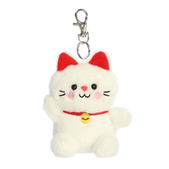 A small white lucky cat plush clip-on with a red collar and gold bell from Palm Pals by Aurora.