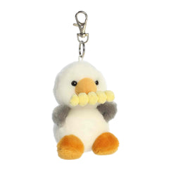 A small white and gray seagull plush clip-on holding a fry in its beak from Palm Pals by Aurora.