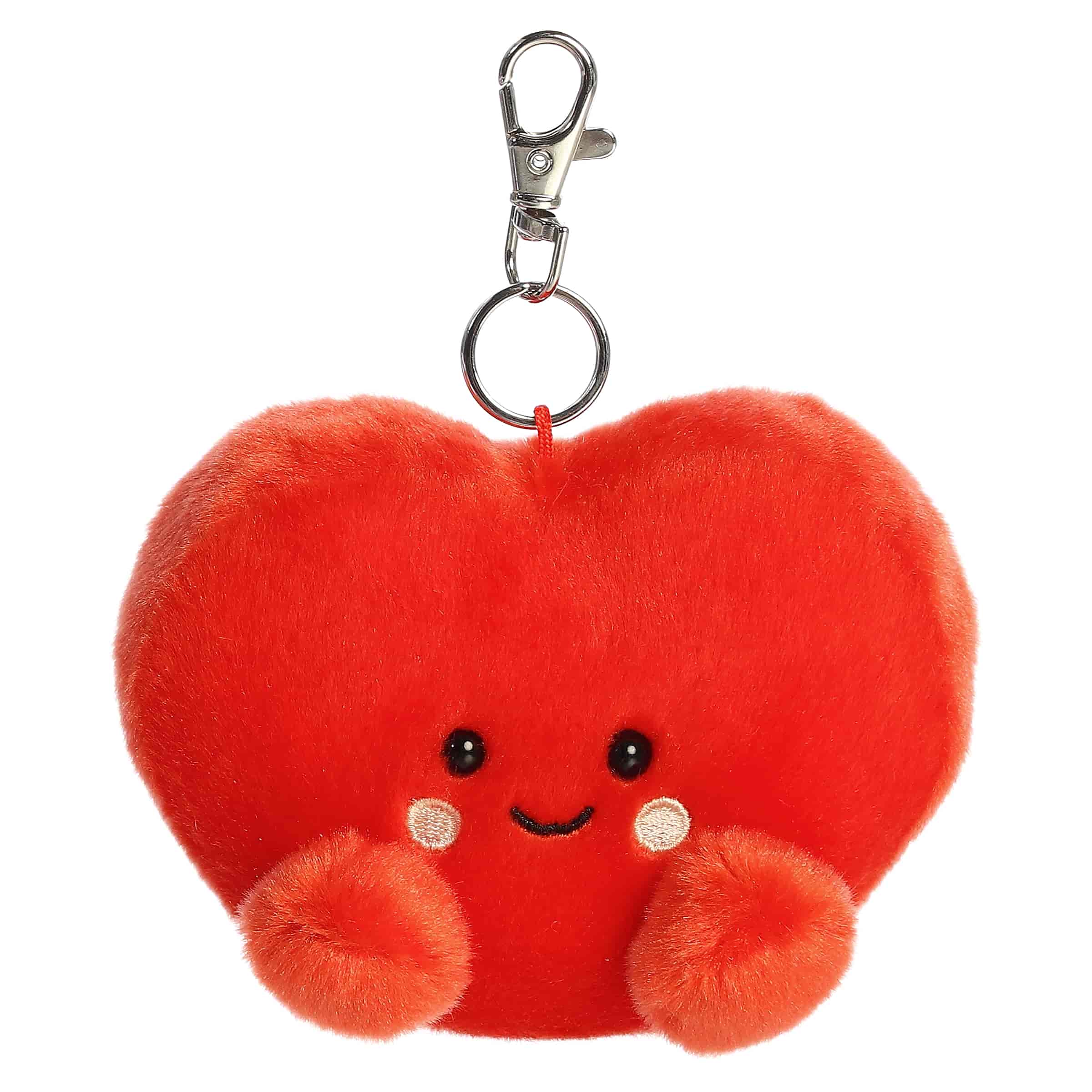 A small red heart plush clip-on with blushing cheeks and a smile from Palm Pals by Aurora.