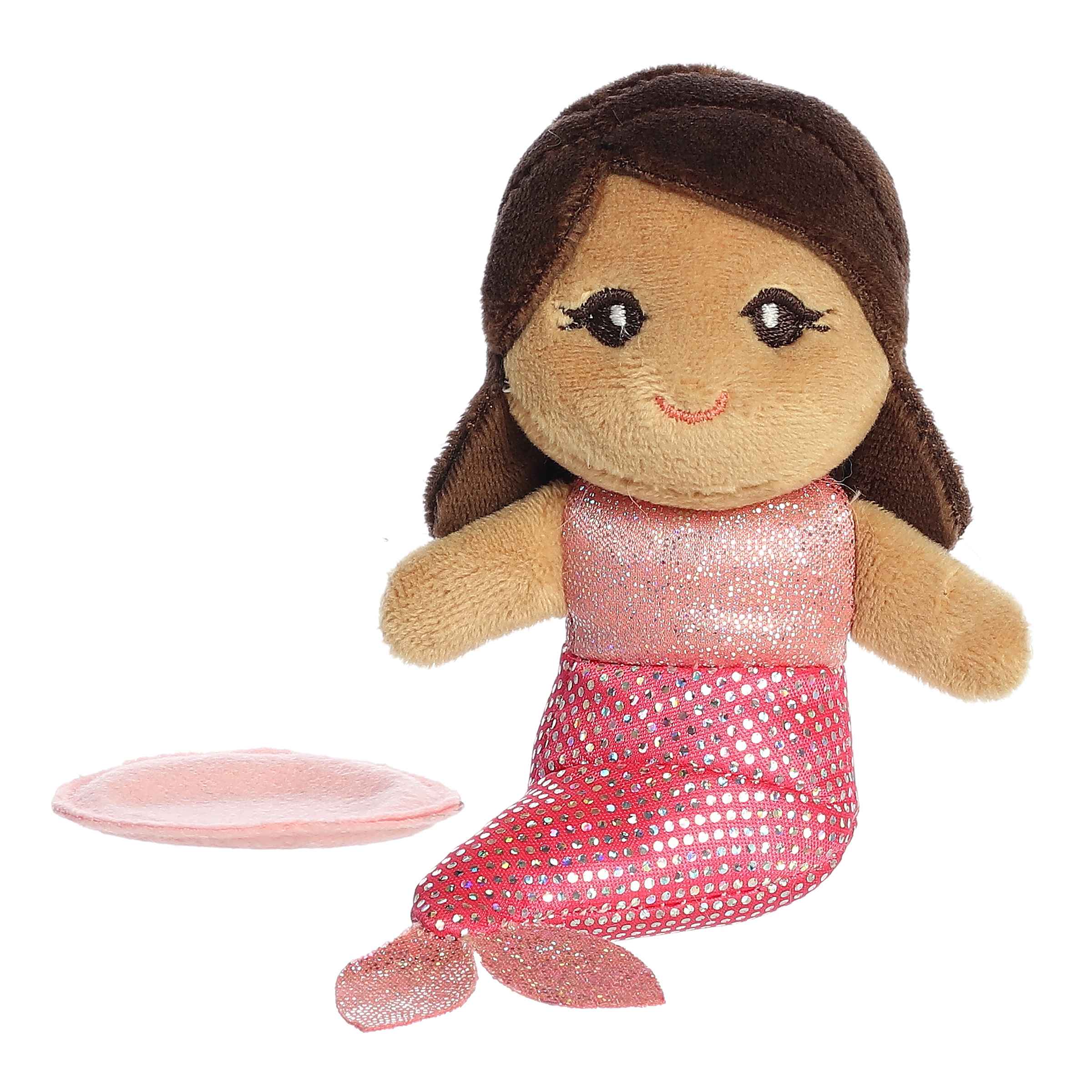 Plush toy of Pink Coral Mermaid from the Shoulderkins collection with brown hair, pink tail, and a magnetic base.