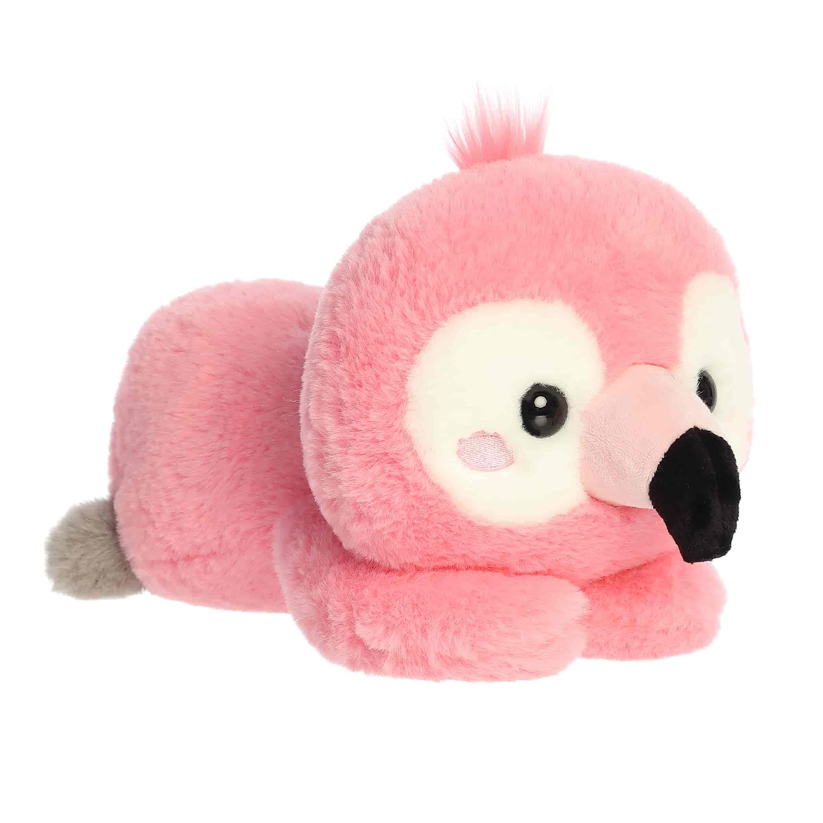 A pink flamingo plush lying belly-down with a black-tipped beak from Too Cute by Aurora.