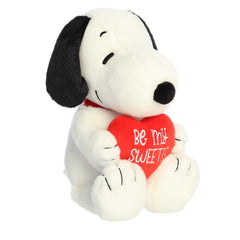 Snoopy plush hugging a big red heart, perfect for gifts and collectors.