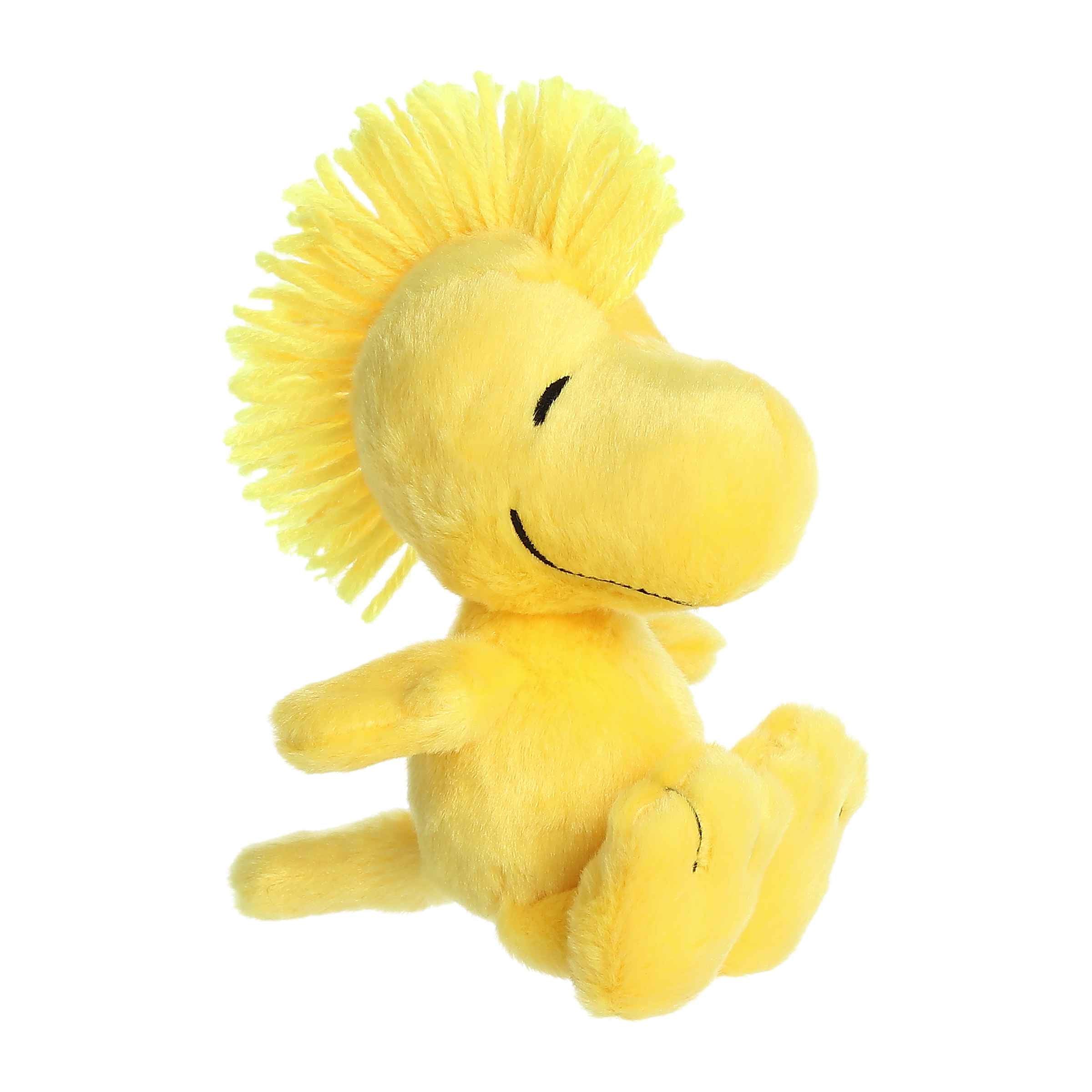 6.5-inch Woodstock plush from the Peanuts plush collection, soft yellow fabric and iconic hair resembling the famous bird