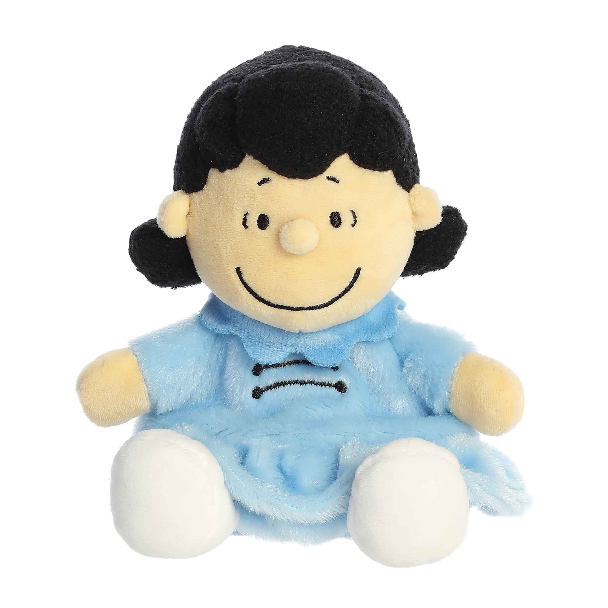 Lucy Palm Pals plush from the Peanuts collection in blue dress, embodies bold character, perfect for cuddles