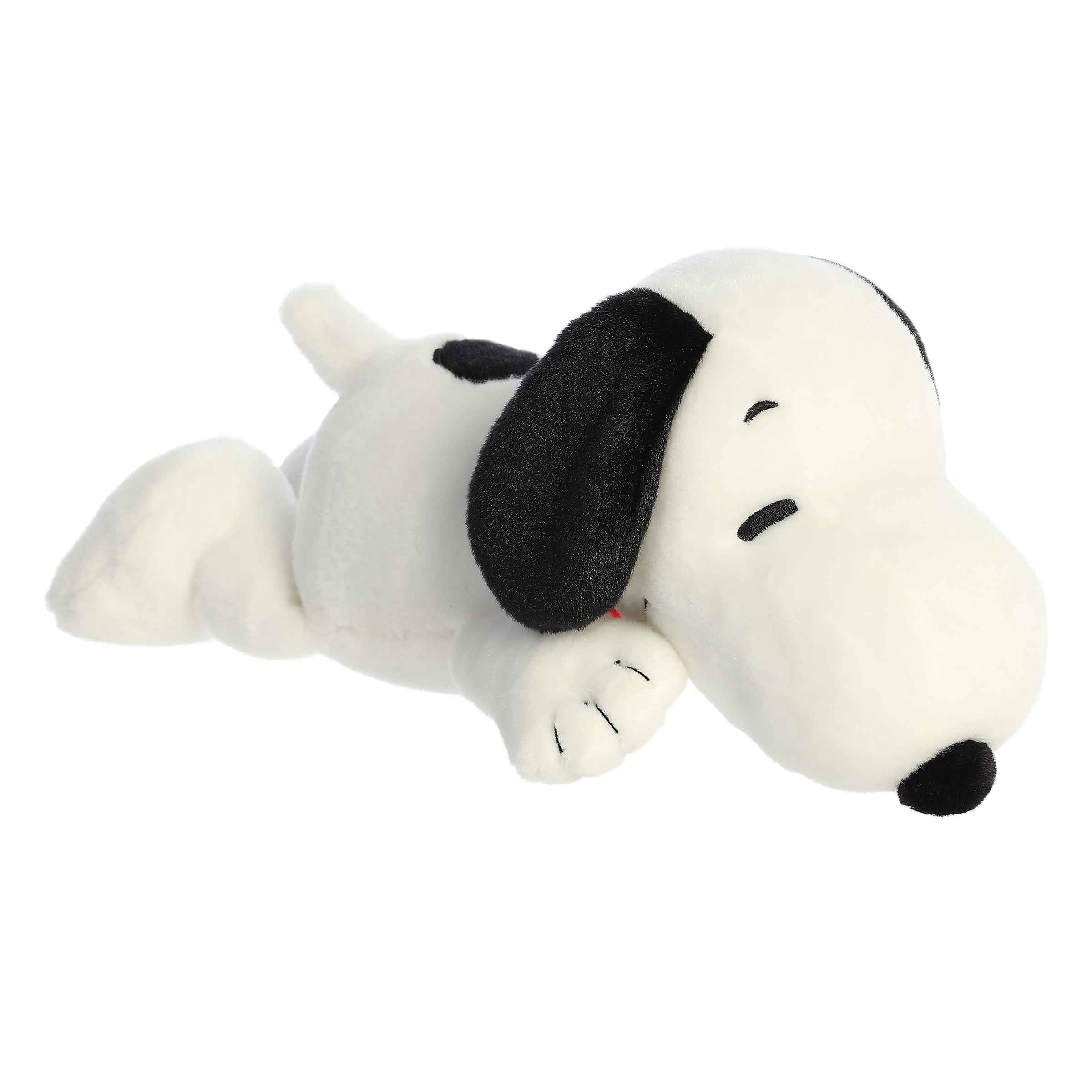 Floppy laying Snoopy plush by Peanuts and Aurora, with signature black ears and red collar