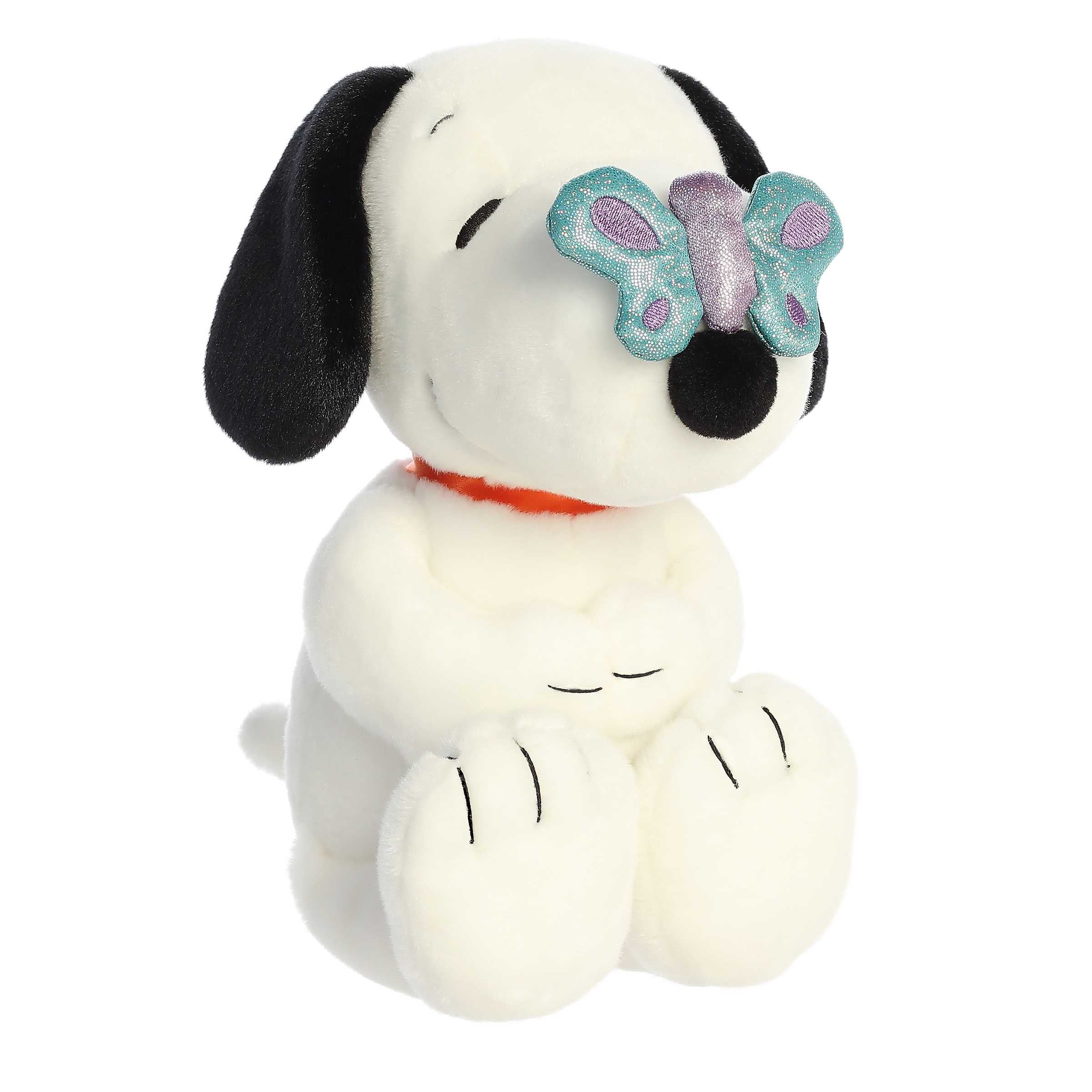 Butterfly Snoopy plush from Peanuts Collection by Aurora, featuring Snoopy with a butterfly on his snout!