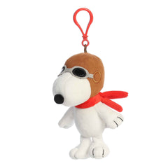 Clip-on plush of Snoopy from the Peanuts collection dressed as the Flying Ace with goggles and a red scarf.