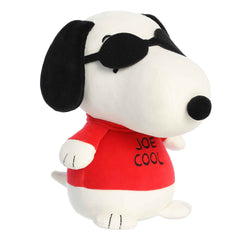 Plush of Snoopy as Joe Cool from the Peanuts collection, seated with beans in the base and wearing sunglasses and a red sweater.