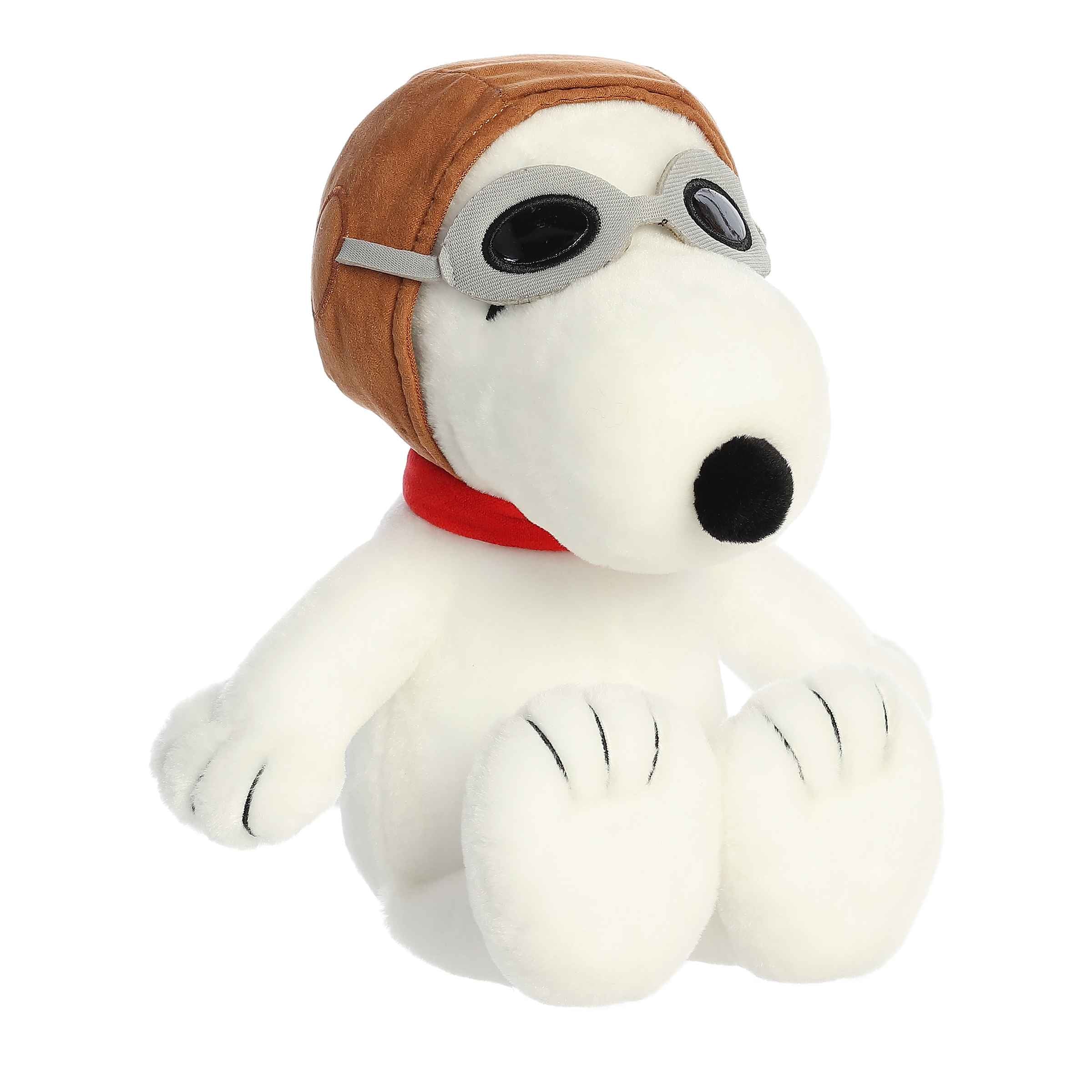 Plush of Snoopy dressed as the Flying Ace from the Peanuts collection, wearing aviator goggles and a pilot’s hat.